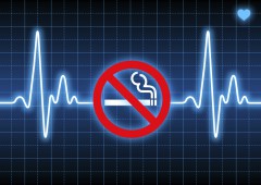 Stop smoking sign on blue heart rate monitor